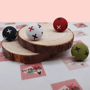 Button stud earrings, edgy cross design.