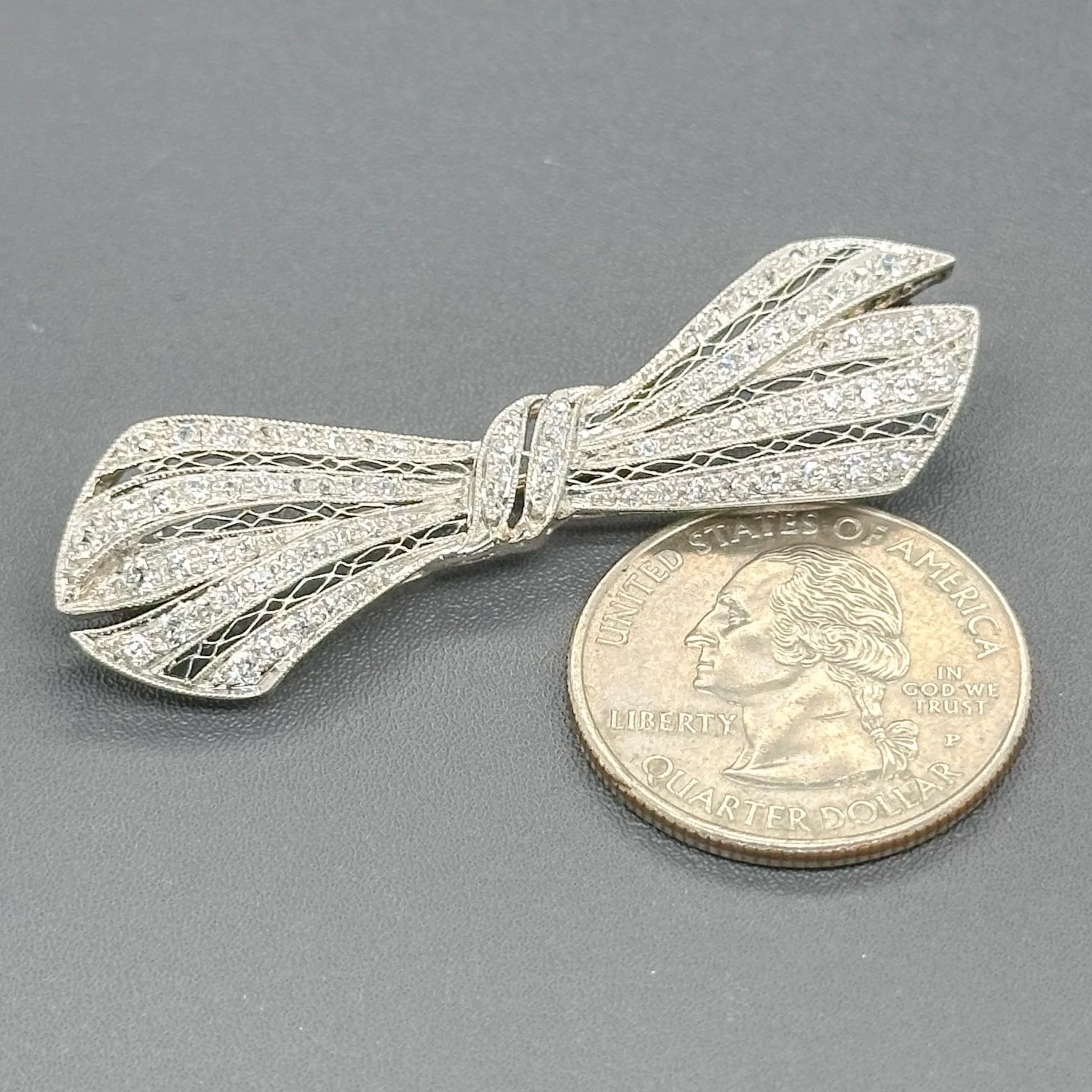 Estate Edwardian Platinum 1.56cttw G-H/SI1-2 Diamond Bow Pin
