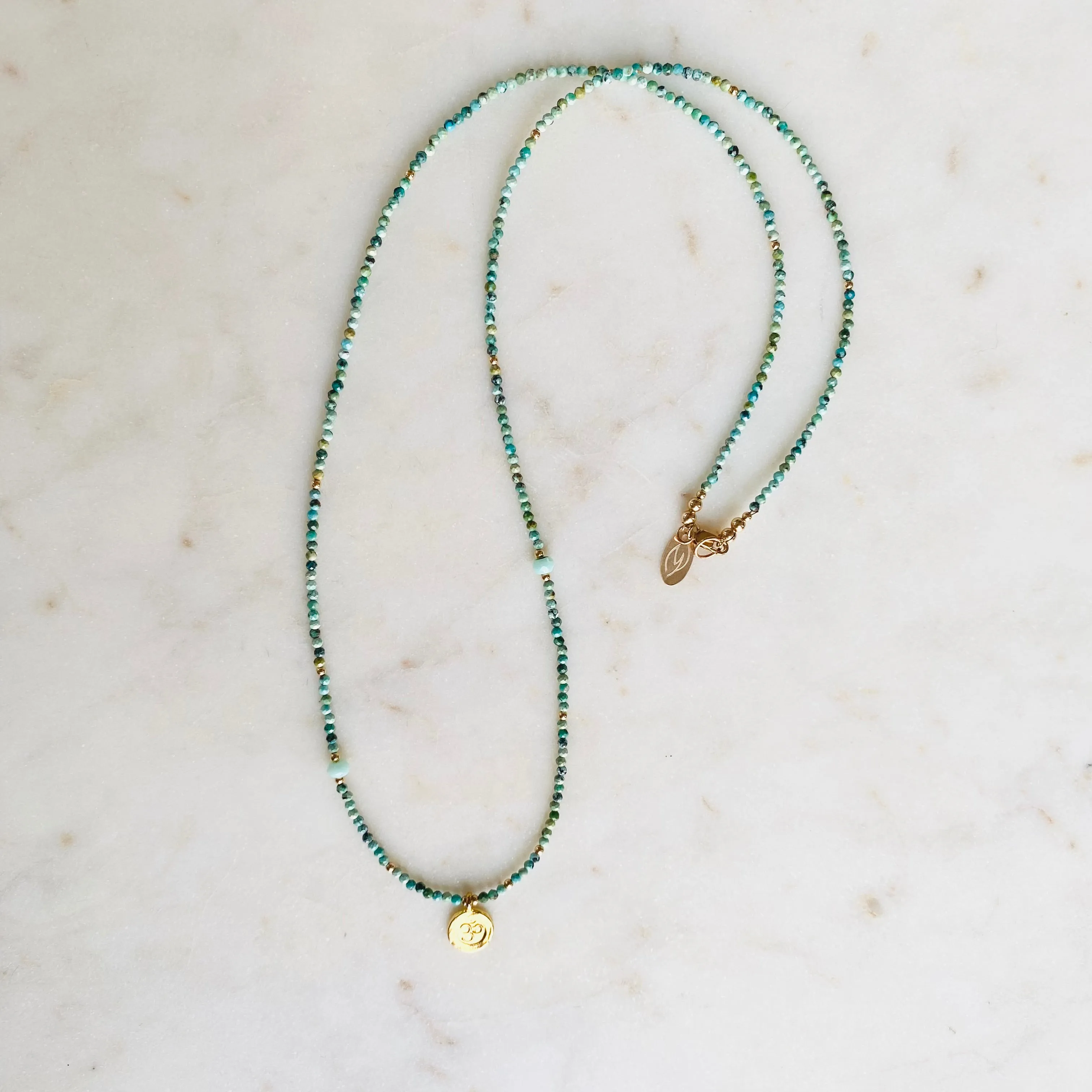 Gold Om Charm Turquoise Necklace