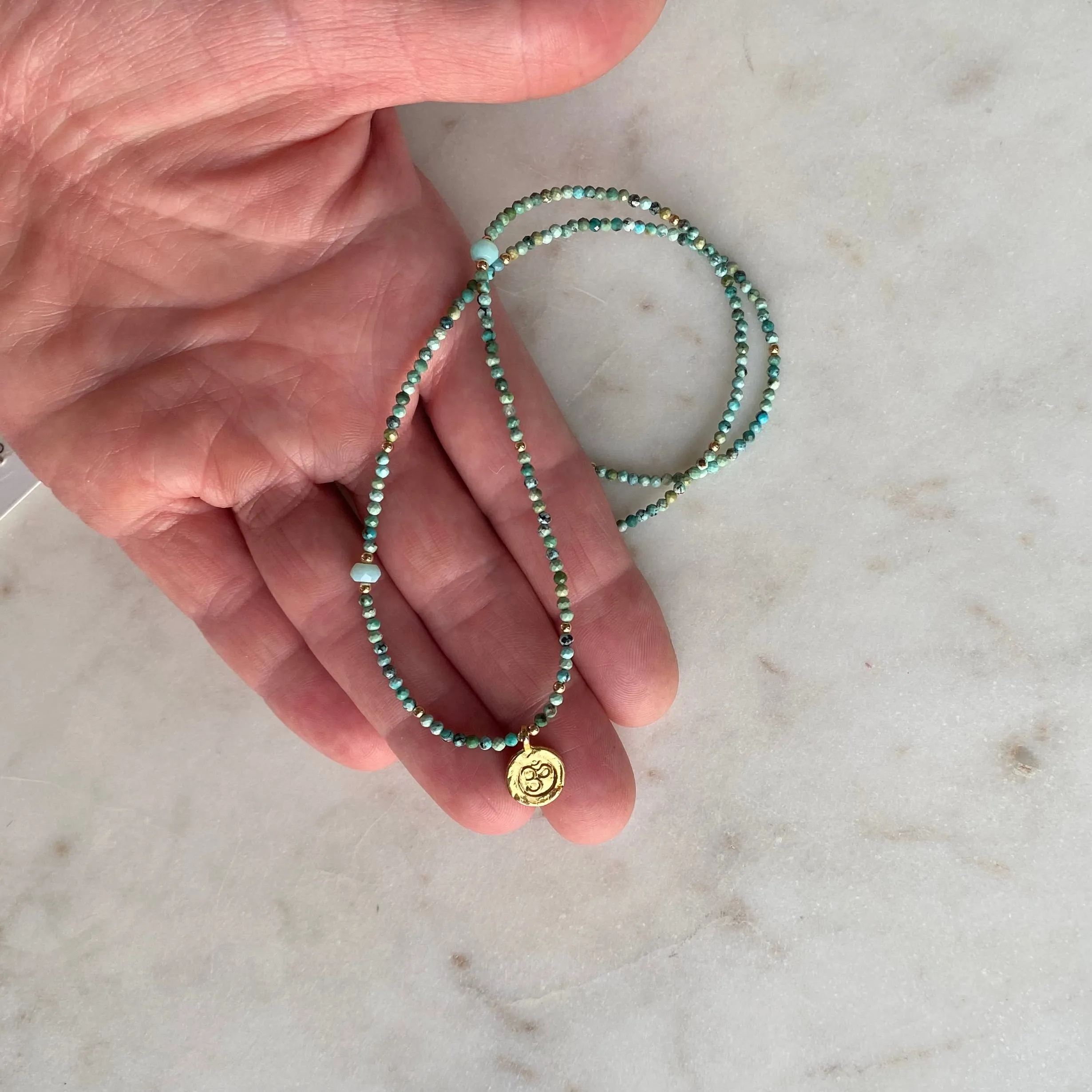 Gold Om Charm Turquoise Necklace