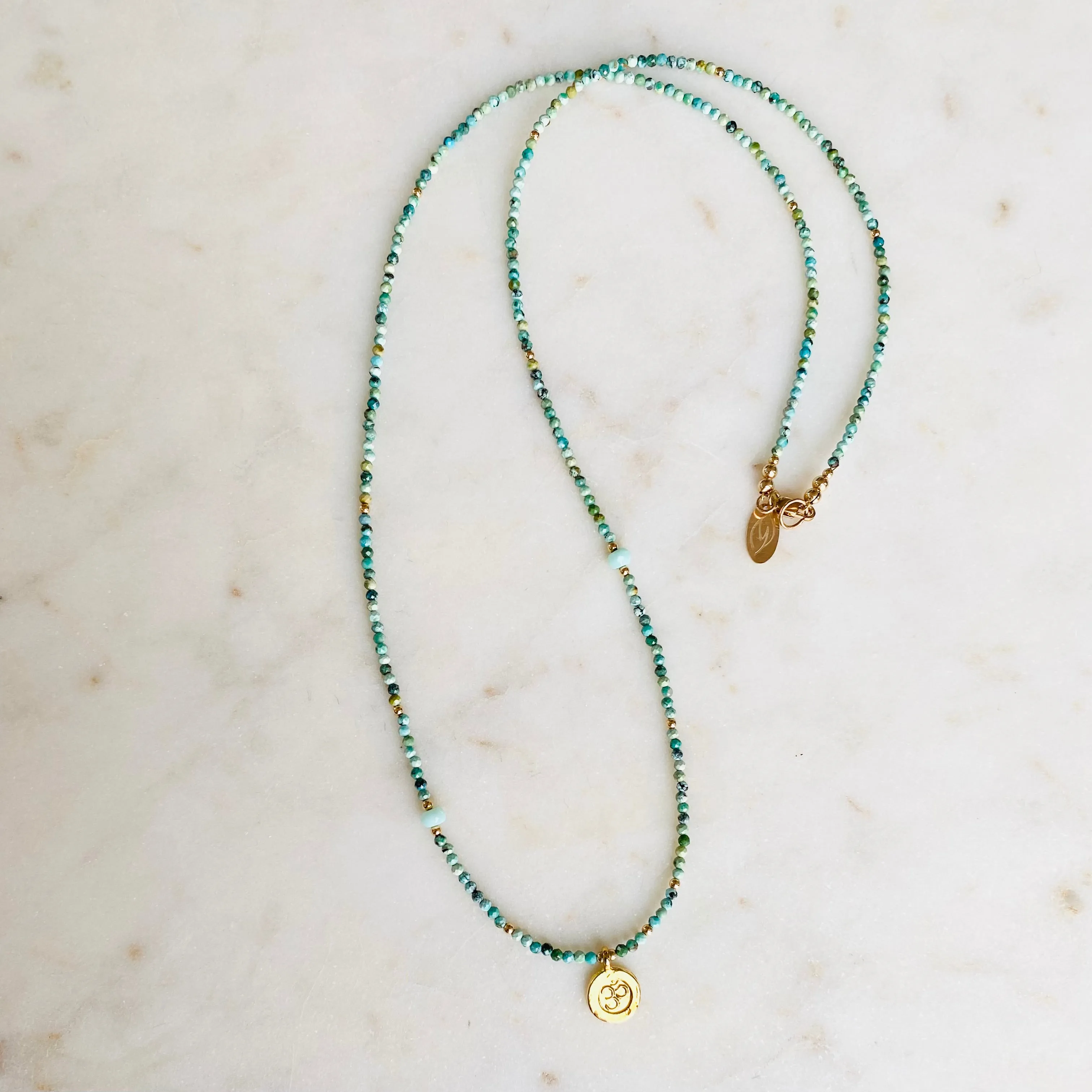 Gold Om Charm Turquoise Necklace
