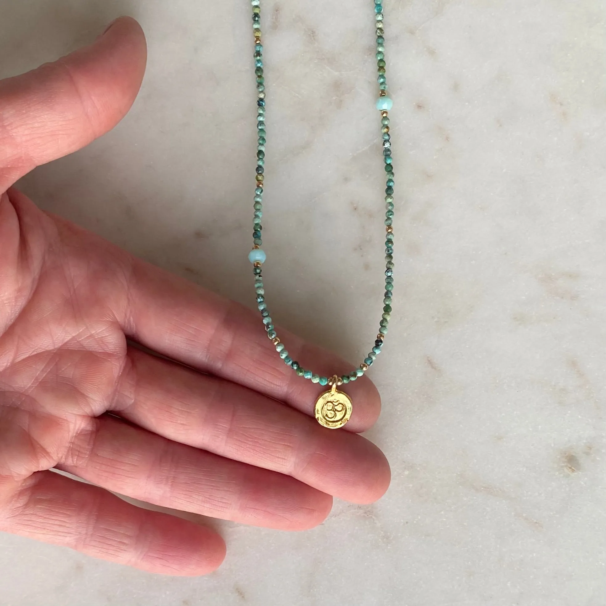 Gold Om Charm Turquoise Necklace